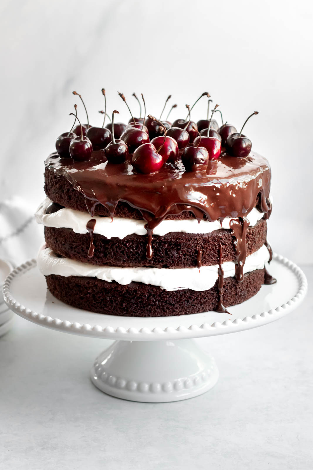 Black forest cake on a cake plate.