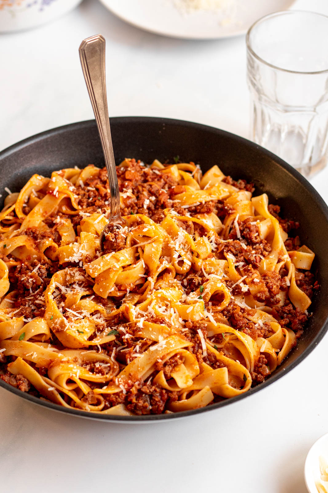 Bolognese sauce with pasta in a pan.