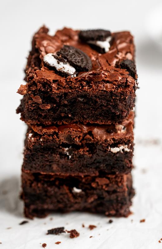 Close up shot of a stack of oreo brownies.
