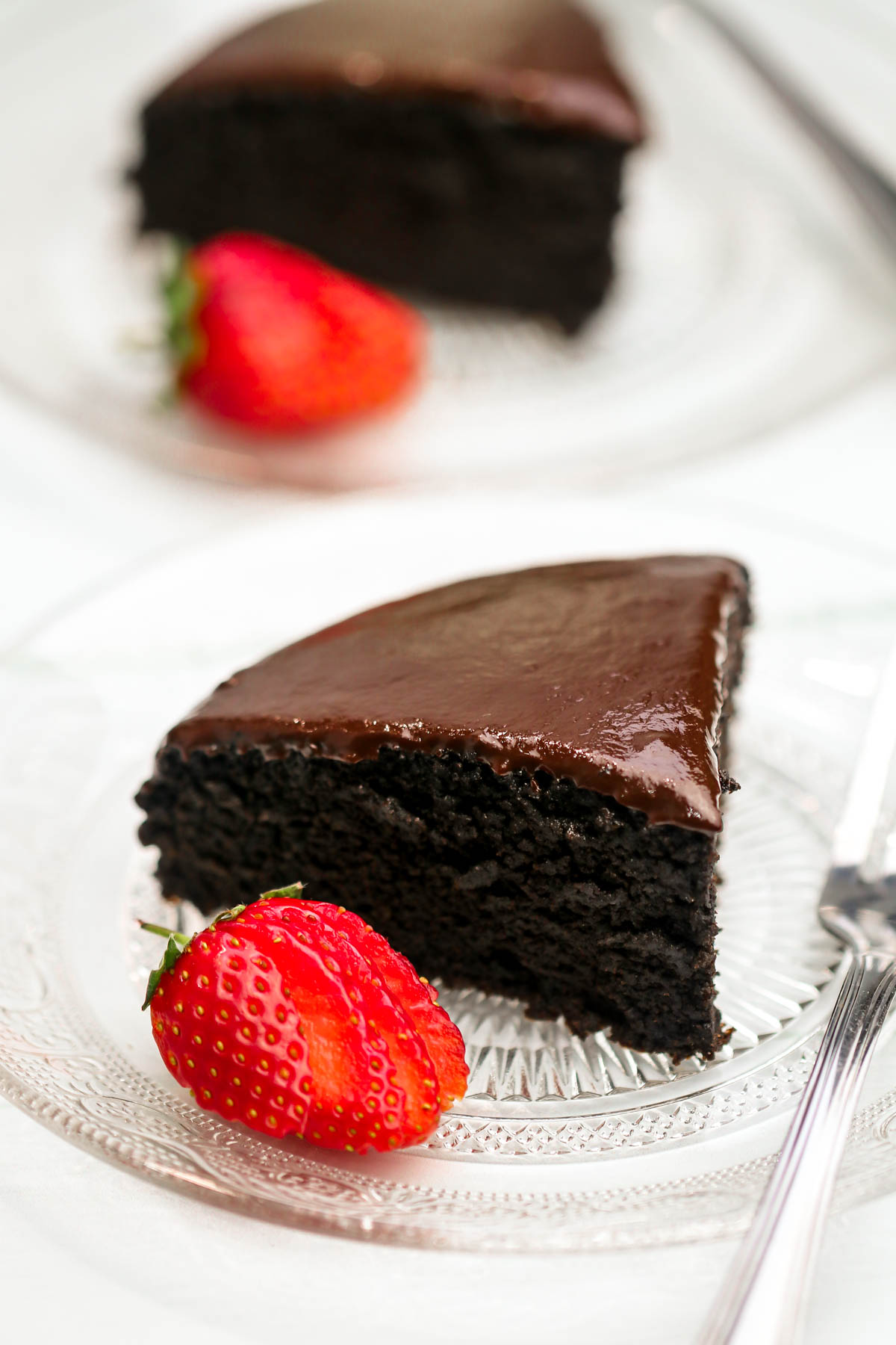 Slice of chocolate cake on a plate.