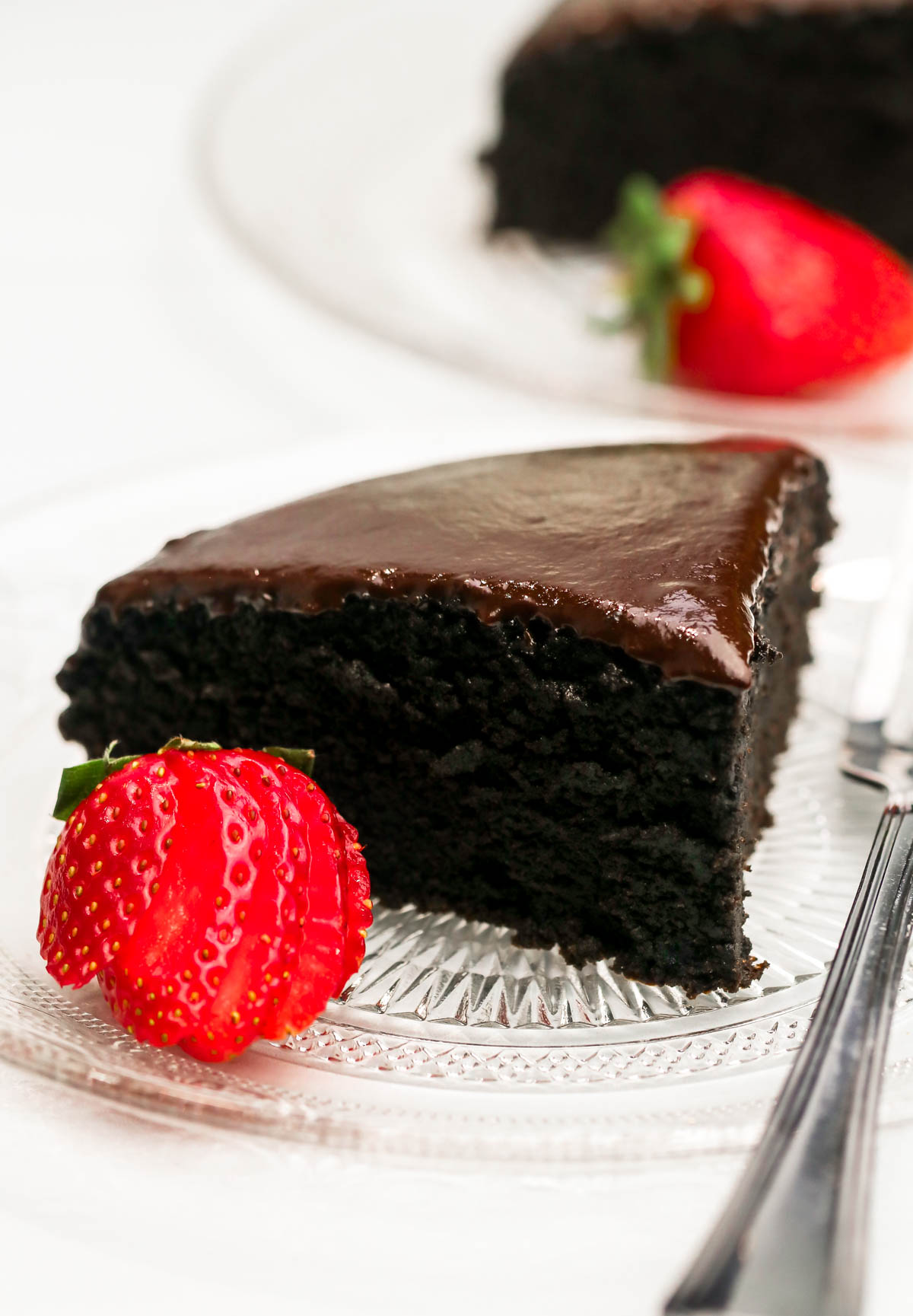 Close up shot of a slice of cake on a plate.