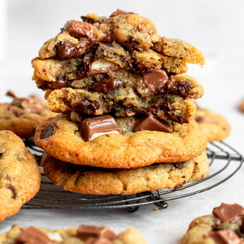 Stack of kinder cookies on a cooling rack.
