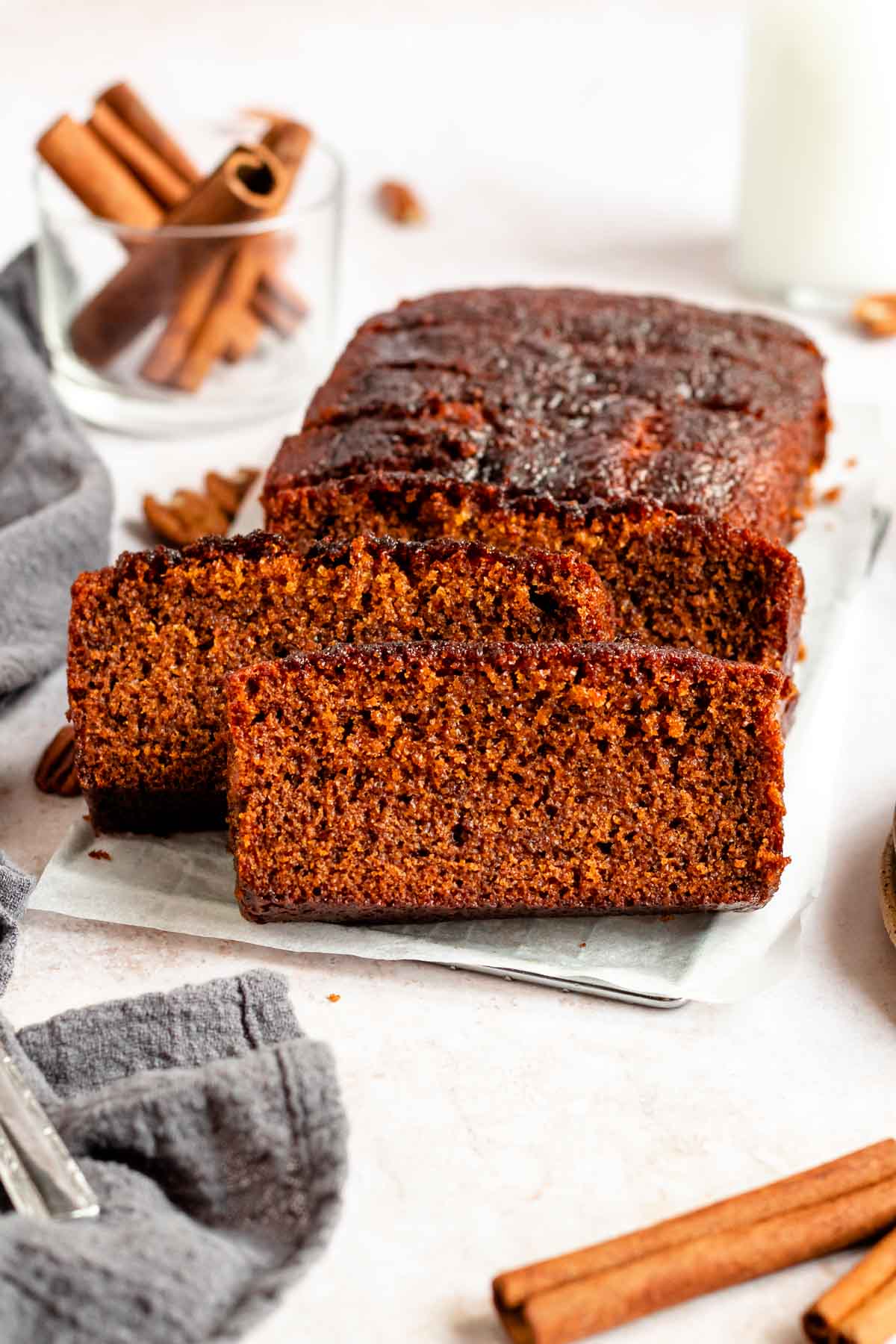 Sliced honey cake on a parchment paper.