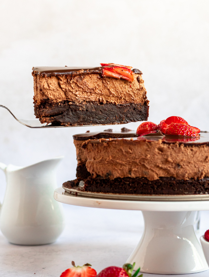 Triple Chocolate Brownie Mousse Cake on a cake platter.