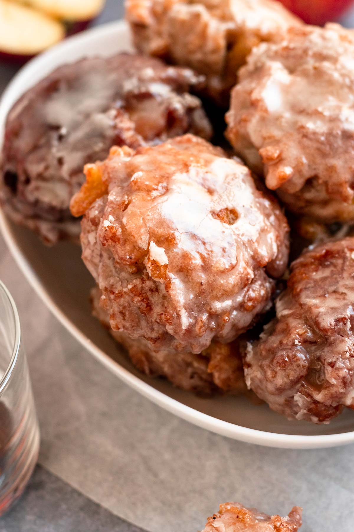 Close up shot of apple fritters in a bowl.