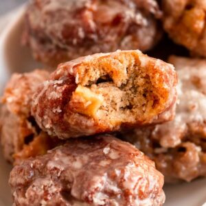 Bite missing from apple fritters.