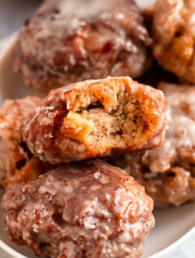 Bite missing from apple fritters.