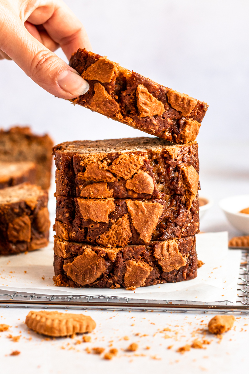 Biscoff banana bread stack with one slice lifted.