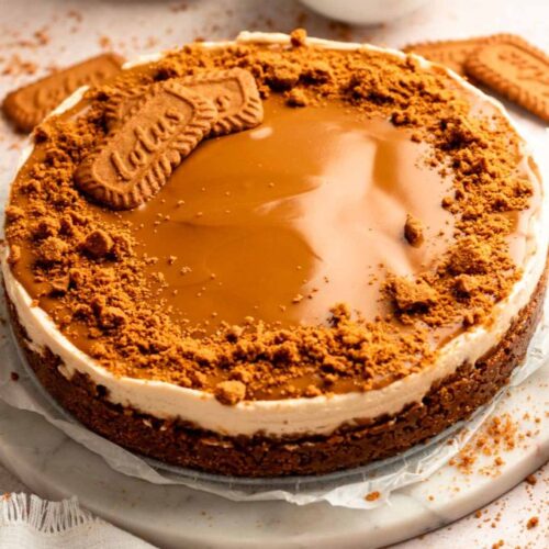 Biscoff cheesecake on a cake plate.