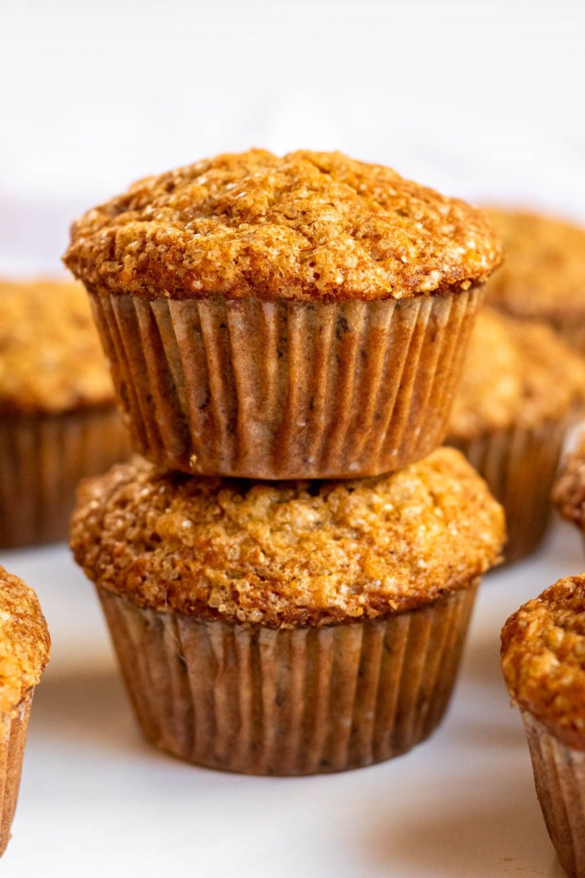 Stack of two easy banana muffins.