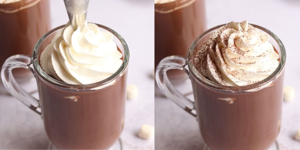 Whipped cream piped on a glass of hot chocolate.