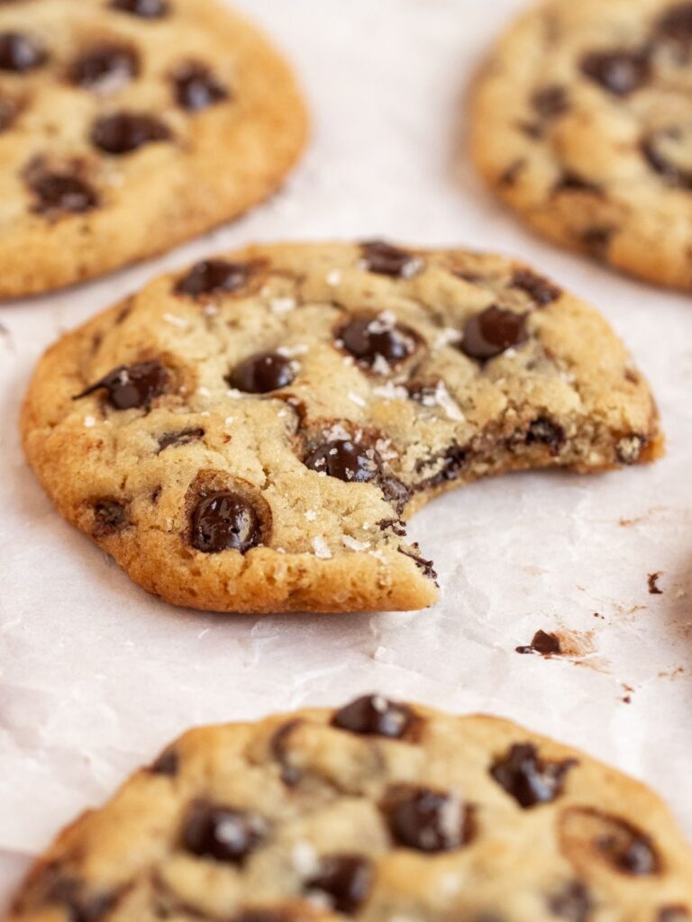 Close up of a cookie with a bite missing.