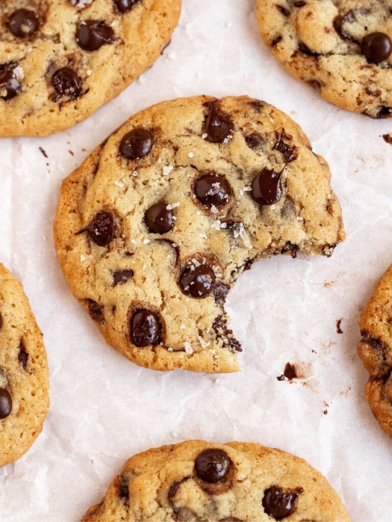 Bite missing from chocolate chip cookie.