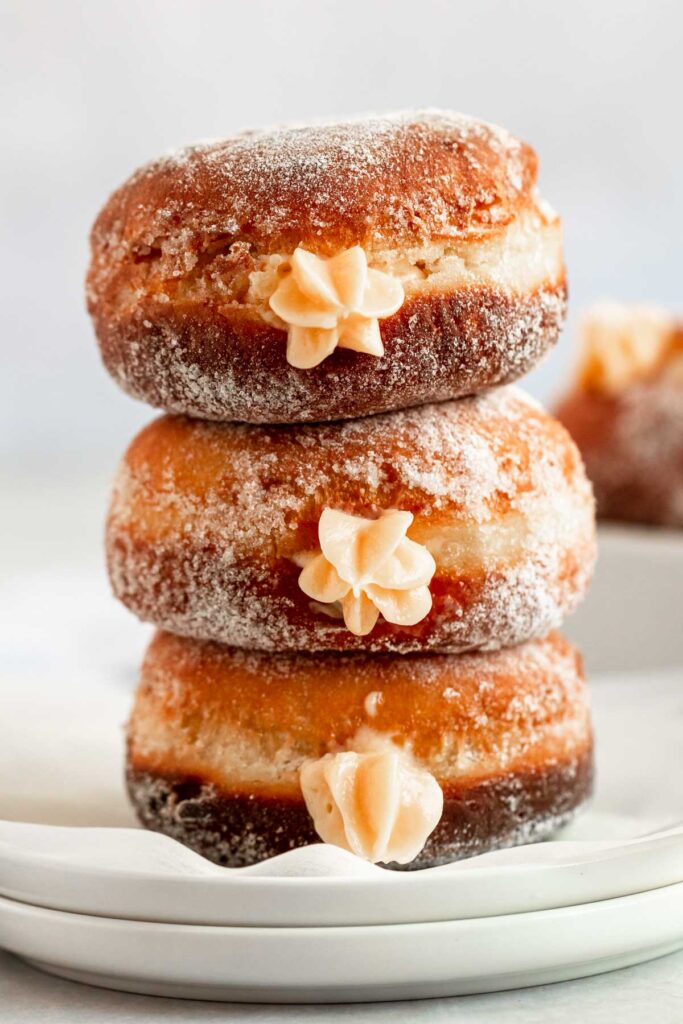 Stack of donuts with vanilla filling,