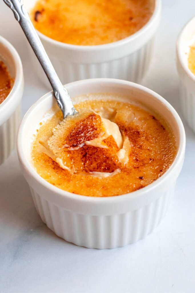 Spoon in a creme brulee dessert.