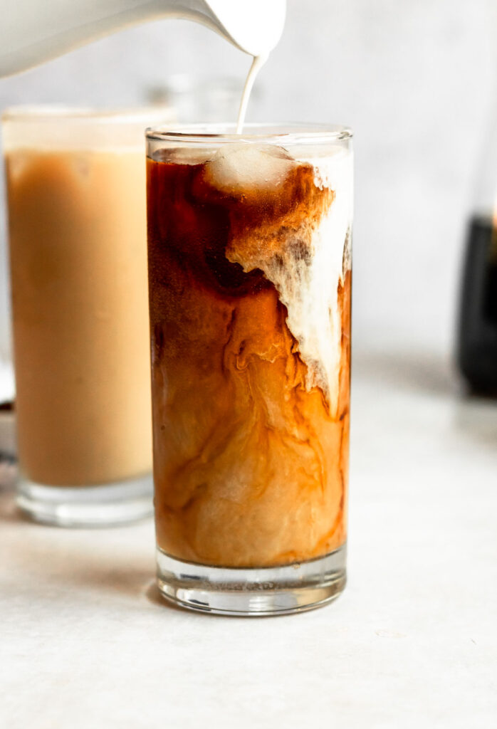 Pour shot of cold brew coffee with sweet cream cold foam.