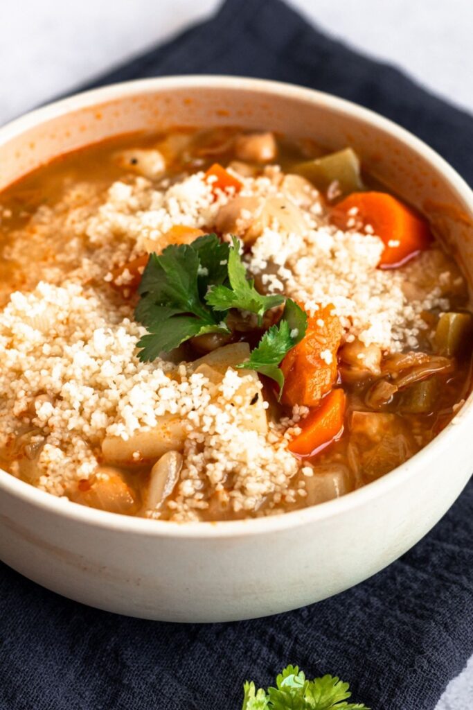Vegetable soup with couscous in a bowl.