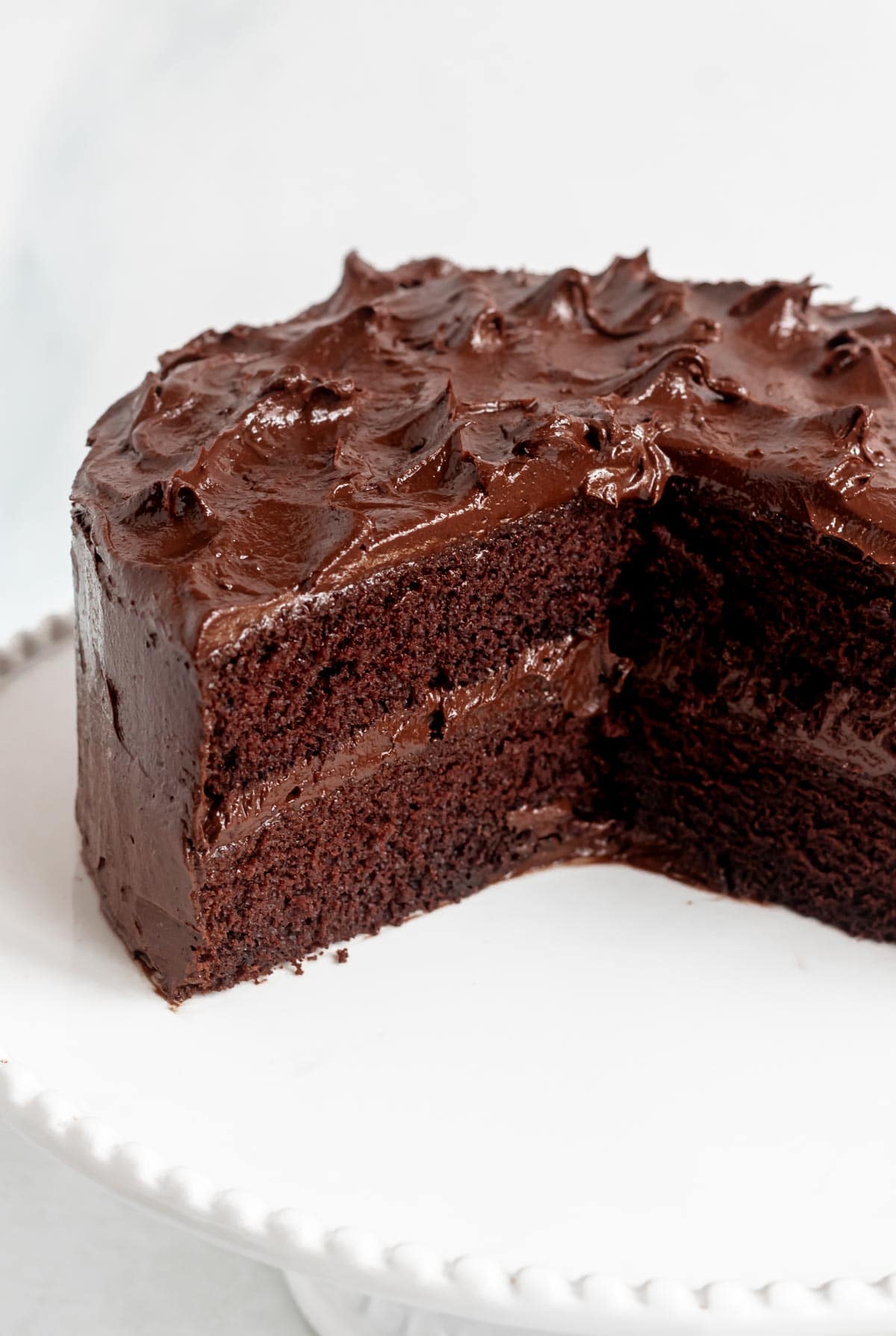 Chocolate cake on a cake stand.