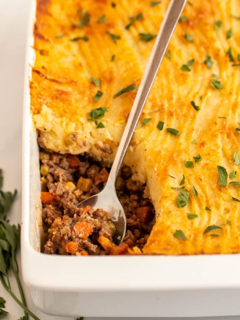 Fork inserted into cottage pie.