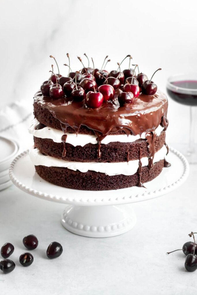 Black forest cake on a cake stand.