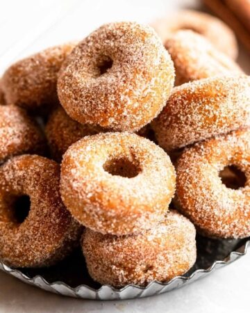 Mini donuts on a gray plate.