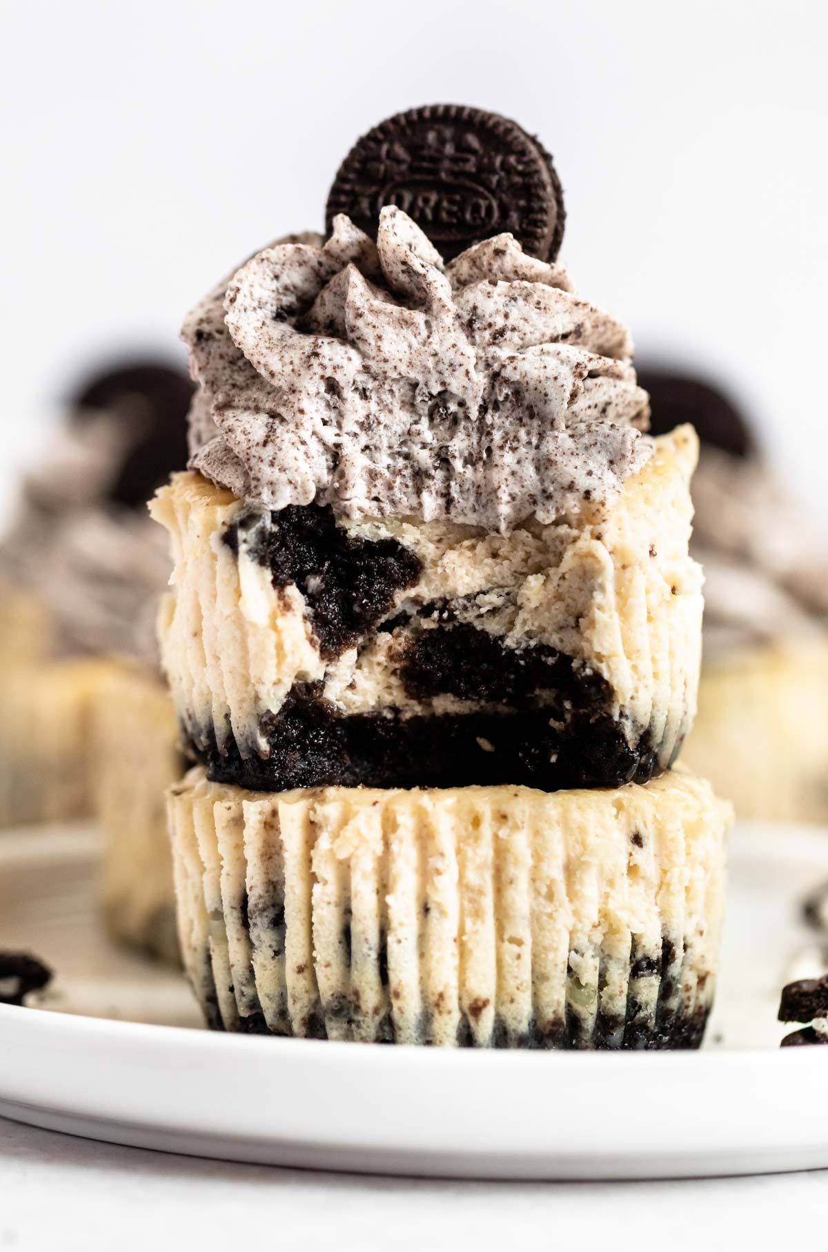 Bite missing from a mini oreo cheesecakes.