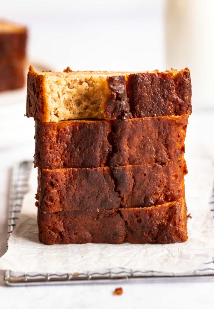 Bite missing from a slice of banana bread without baking soda.