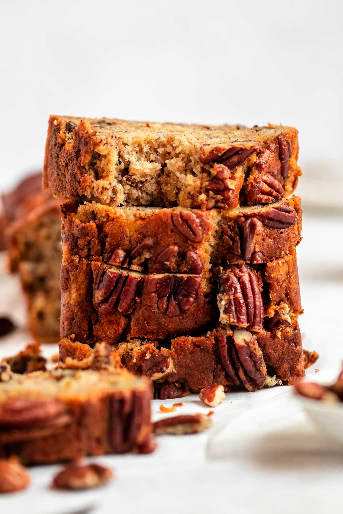 Close up shot of banana bread with pecan.