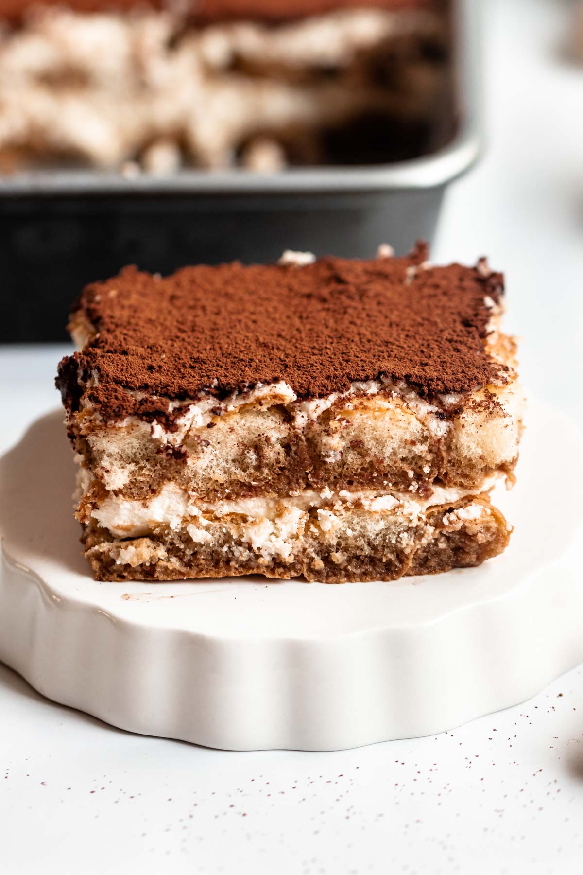 Slice of cake on a white plate.