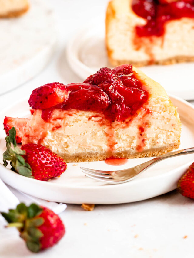 Slice of strawberry cheesecake on a plate.