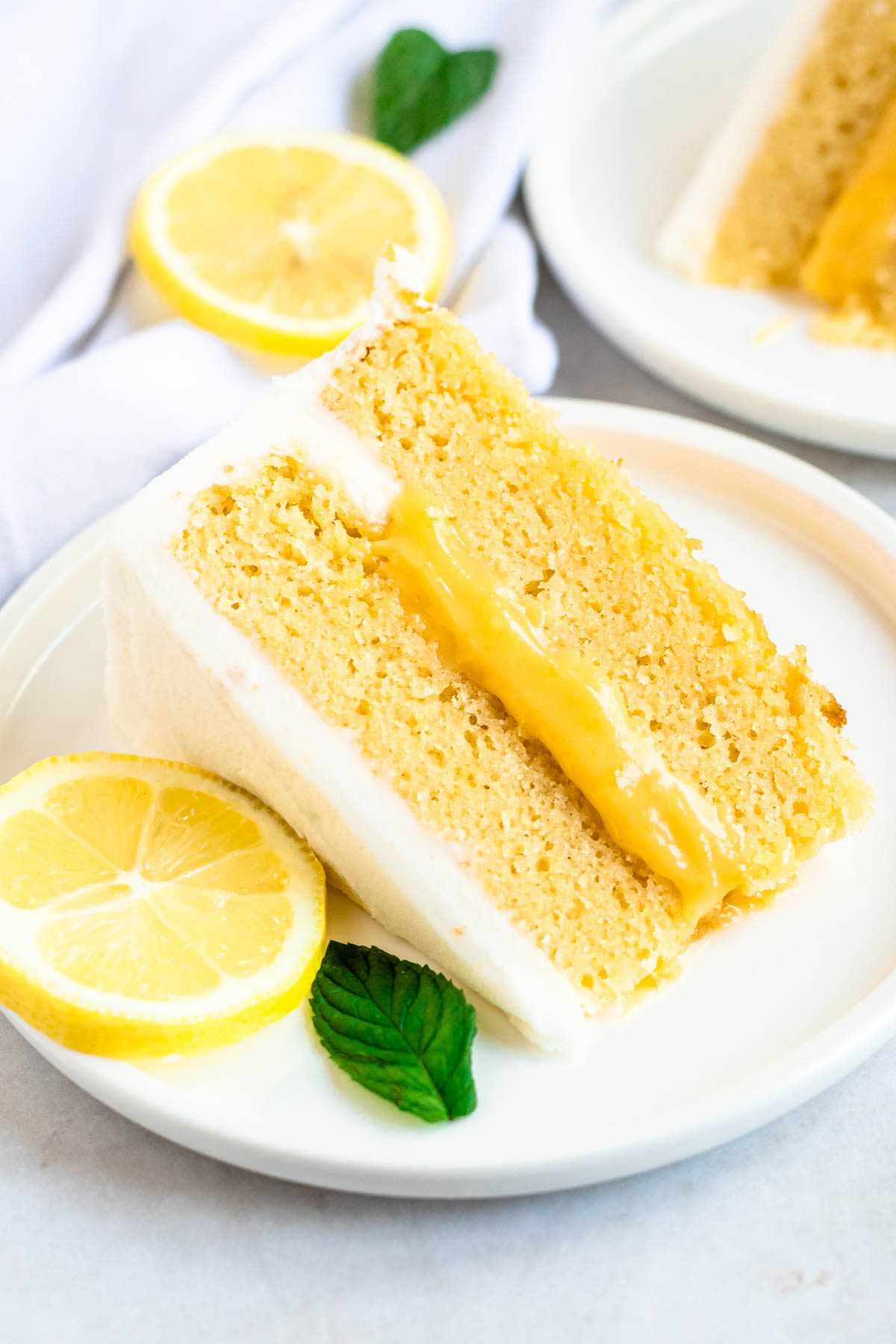 Slice of lemon curd cake on a plate.