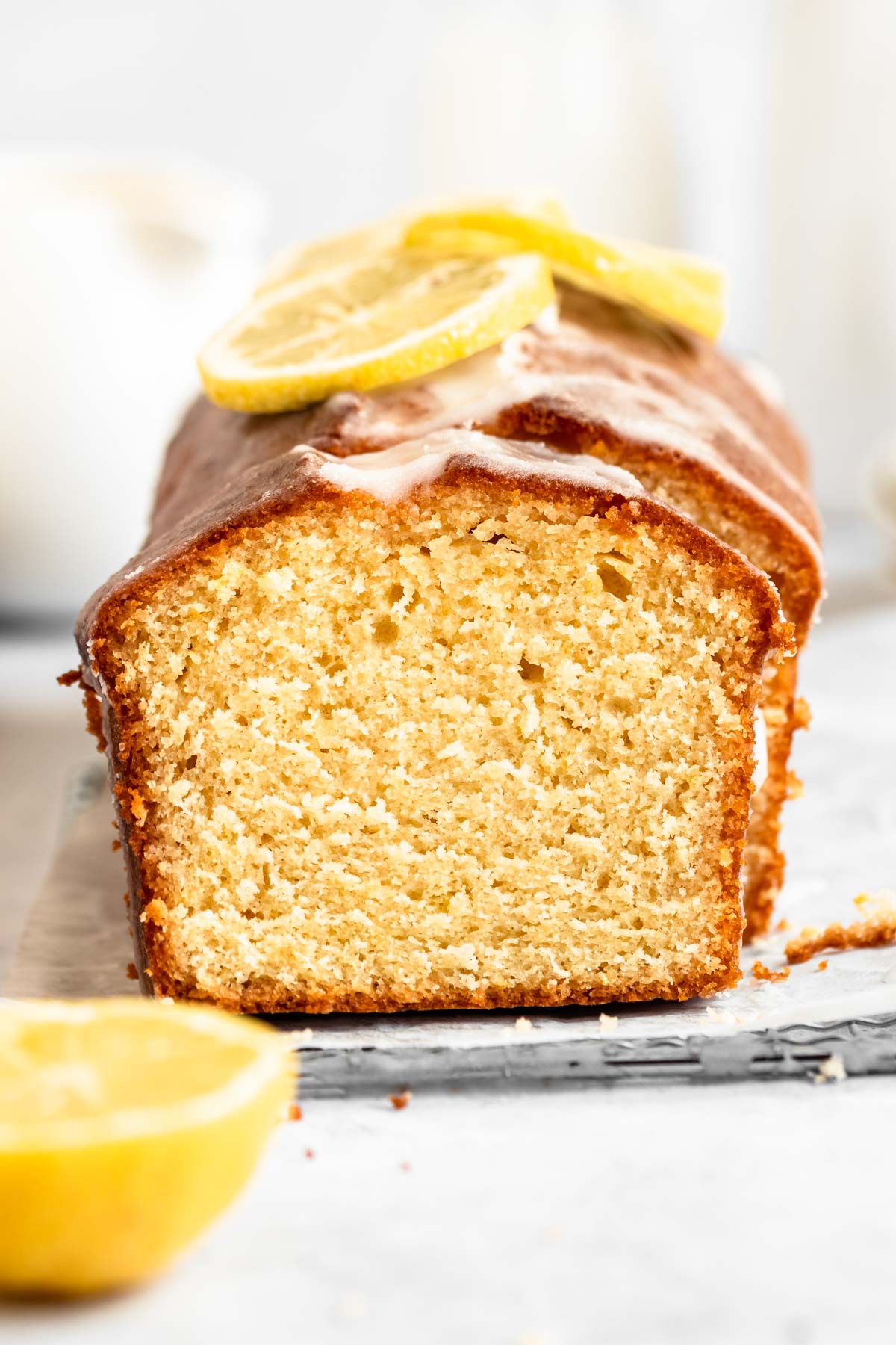 Lemon pound cake on a white parchment paper.