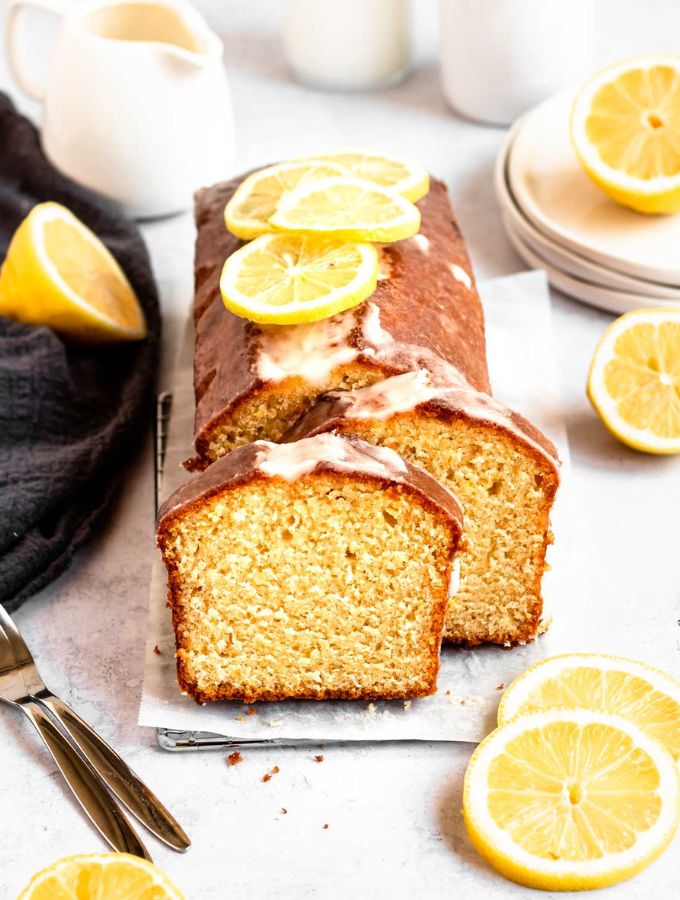 Sliced lemon pound cake on a parchment paper.