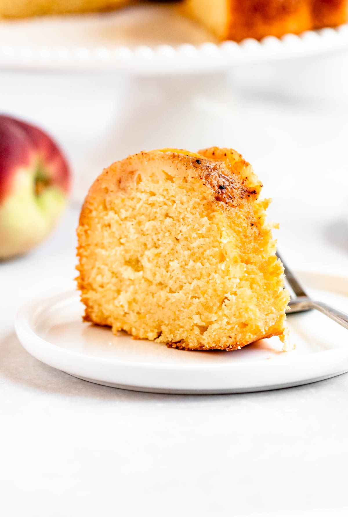 Close up shot of a slice of peach cobbler pound cake.