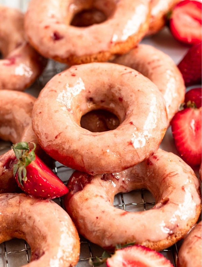 Close up shot of strawberry glazed donuts.