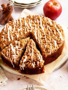 Slice pulled out from an apple crumble cake.