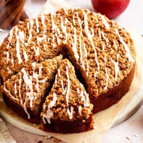 Slice pulled out from an apple crumble cake.