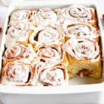 Close up shot of homemade cinnamon rolls in a pan.