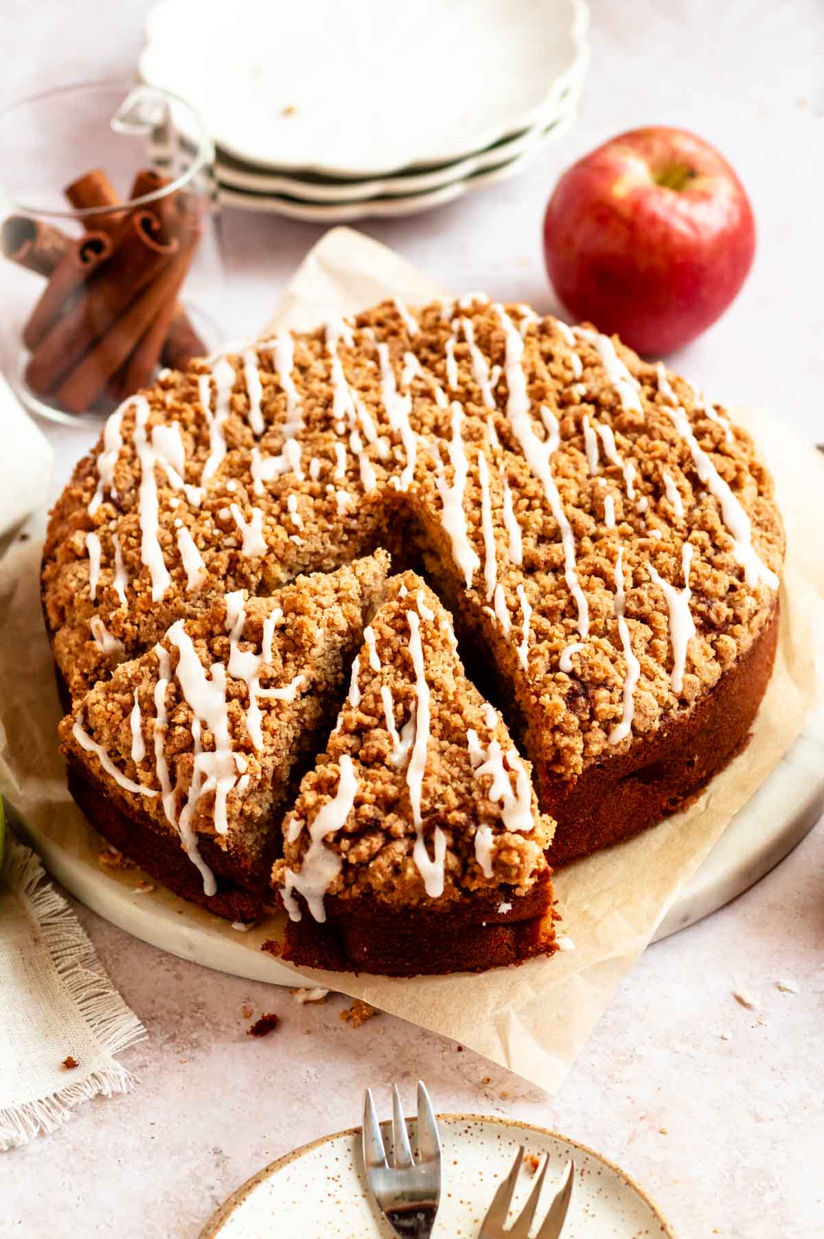 Slice pulled out from an apple crumble cake.