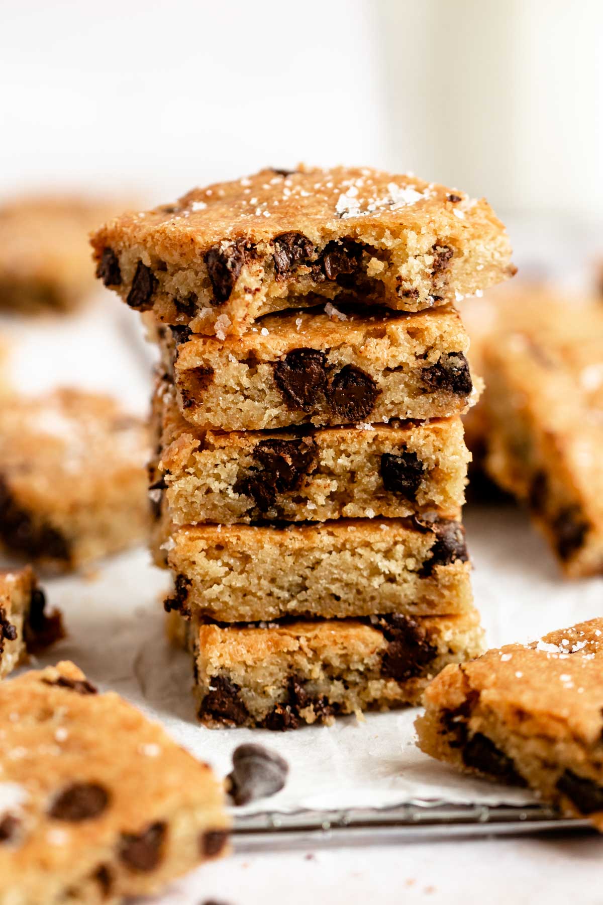 Close up shot of a stack of chocolate chip blondies.