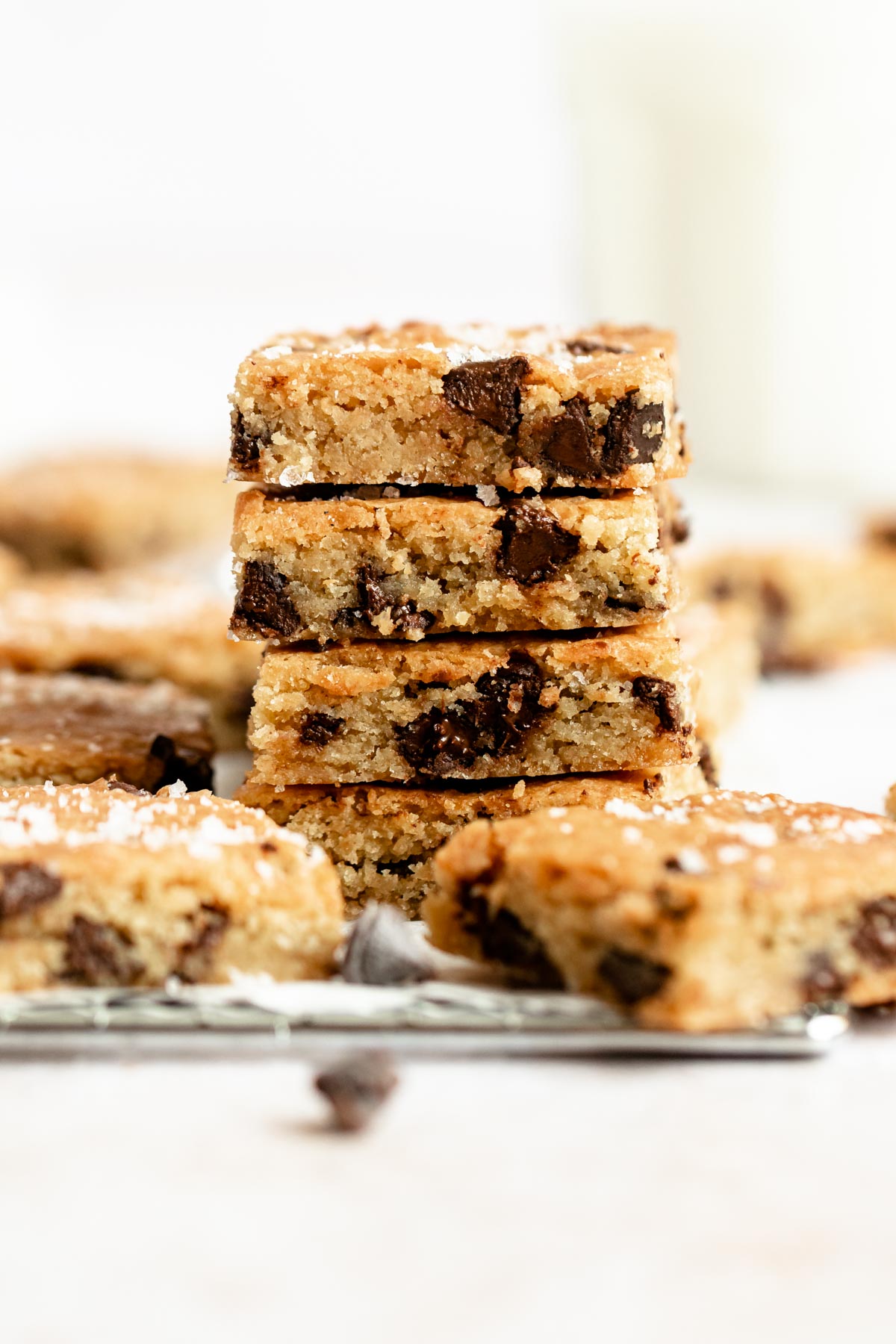 Close up shot of a stack of blondies with chocolate chips.