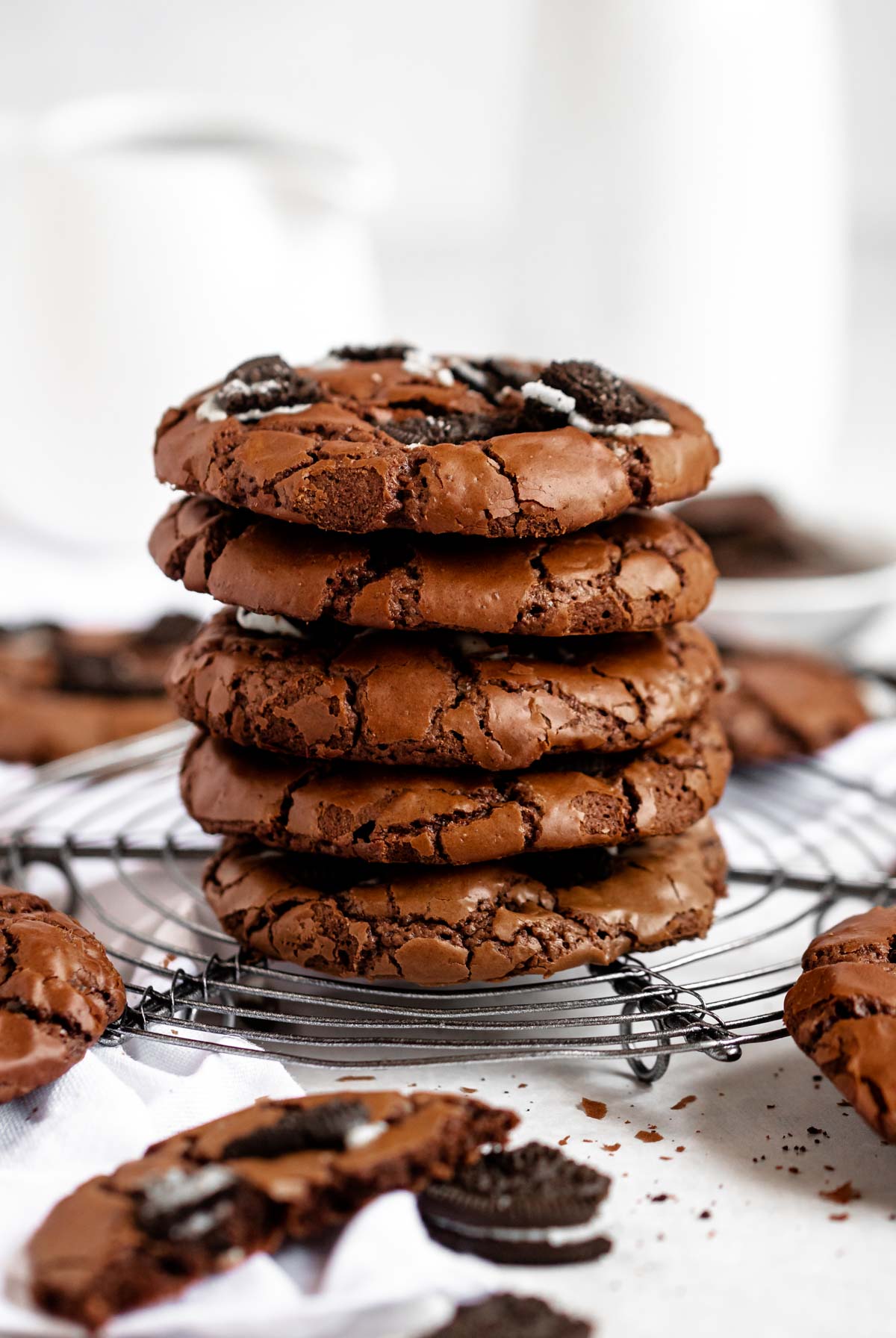 Stack of cookies on a round cooling rack.
