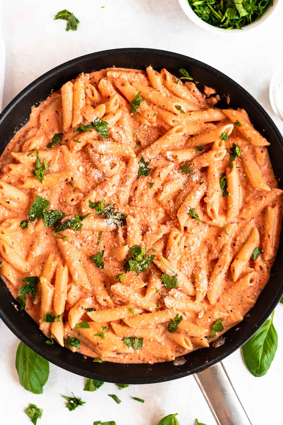 Overhead shot of a pan with pink sauce pasta.