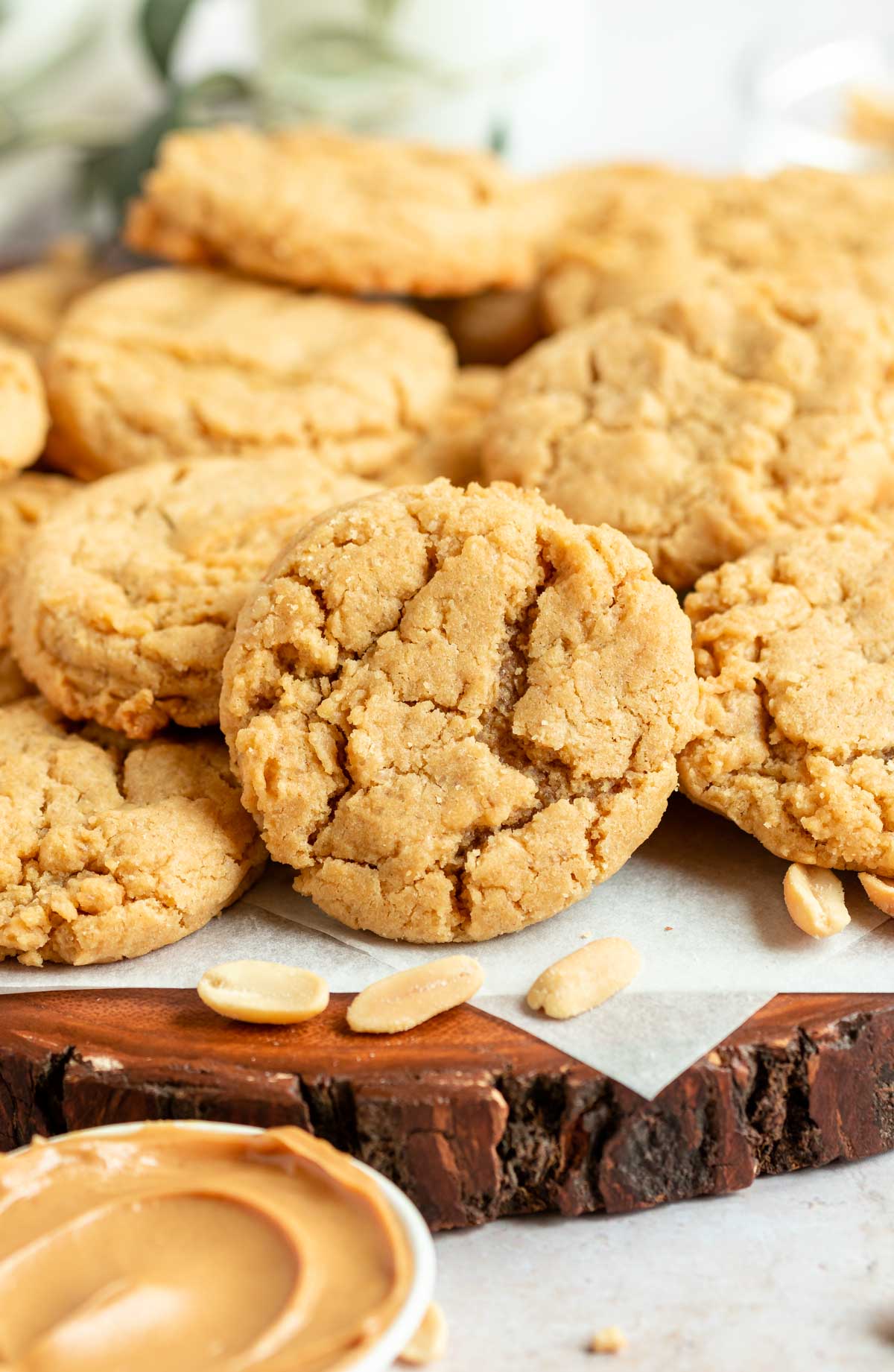 Chewy peanut butter cookies on a parchment paper.