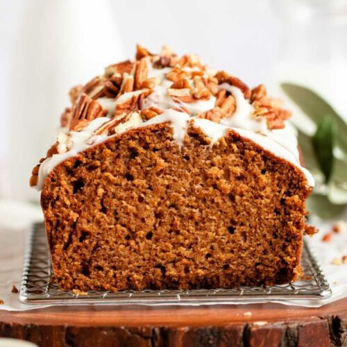 Close up shot of pumpkin bread with cream cheese frosting.
