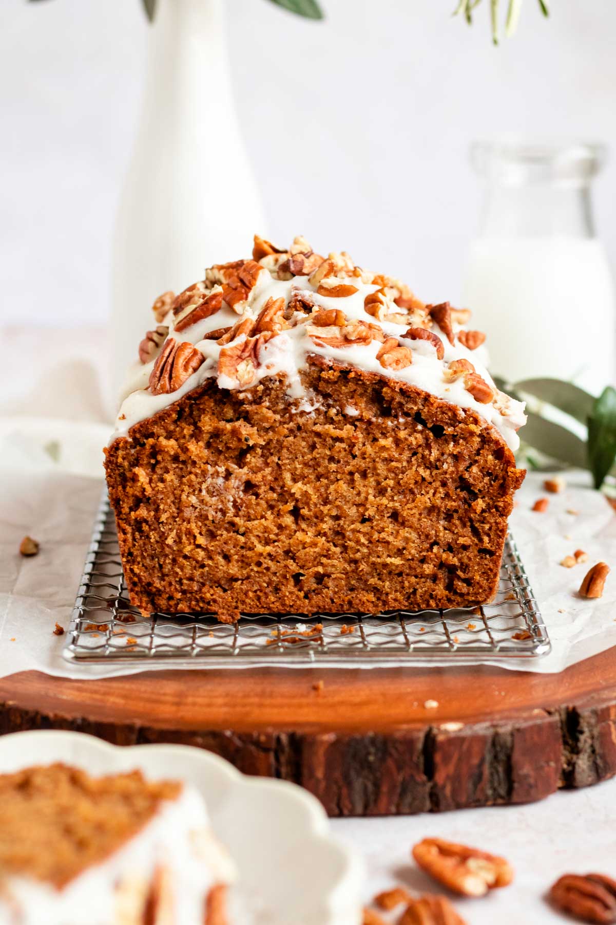 Close up shot of pumpkin bread with cream cheese icing.