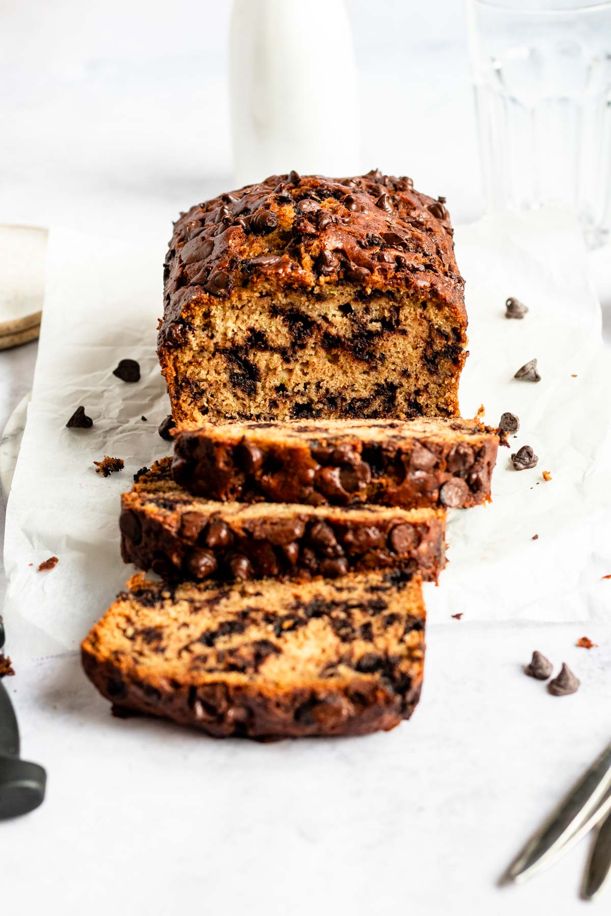 Zucchini chocolate chip bread on a parchment paper.