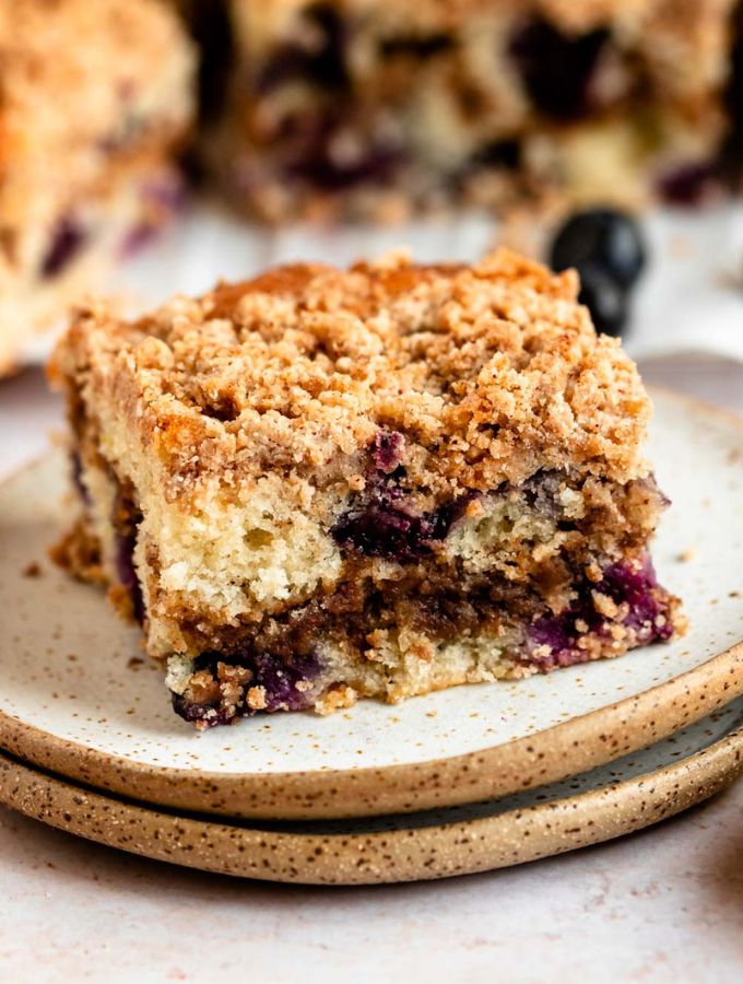 Slice of blueberry coffee cake on a plate.