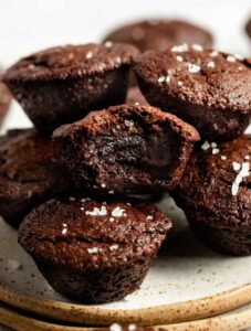 Stack of mini brownie bites with a bite missing from the middle one.
