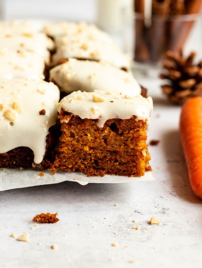 Sliced easy carrot cake on a parchment paper.